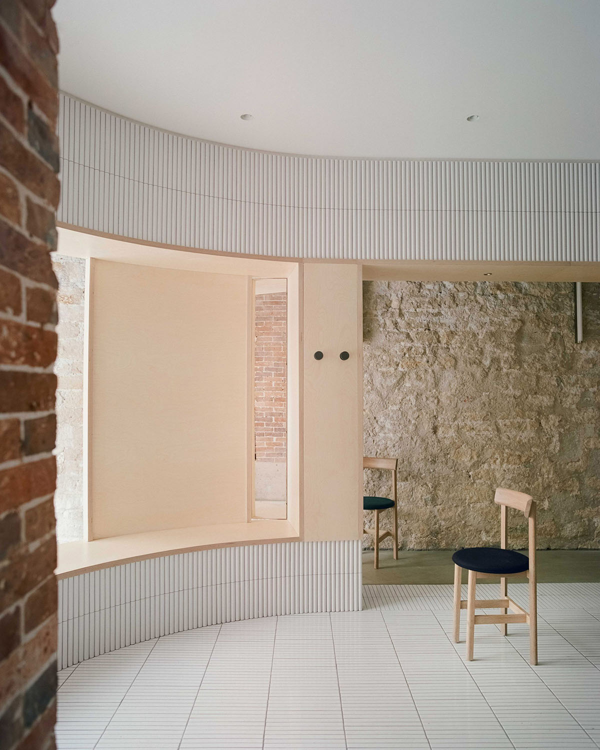 Neri&Hu-designed restaurant in Paris exposes layering material history with oblong volume inside