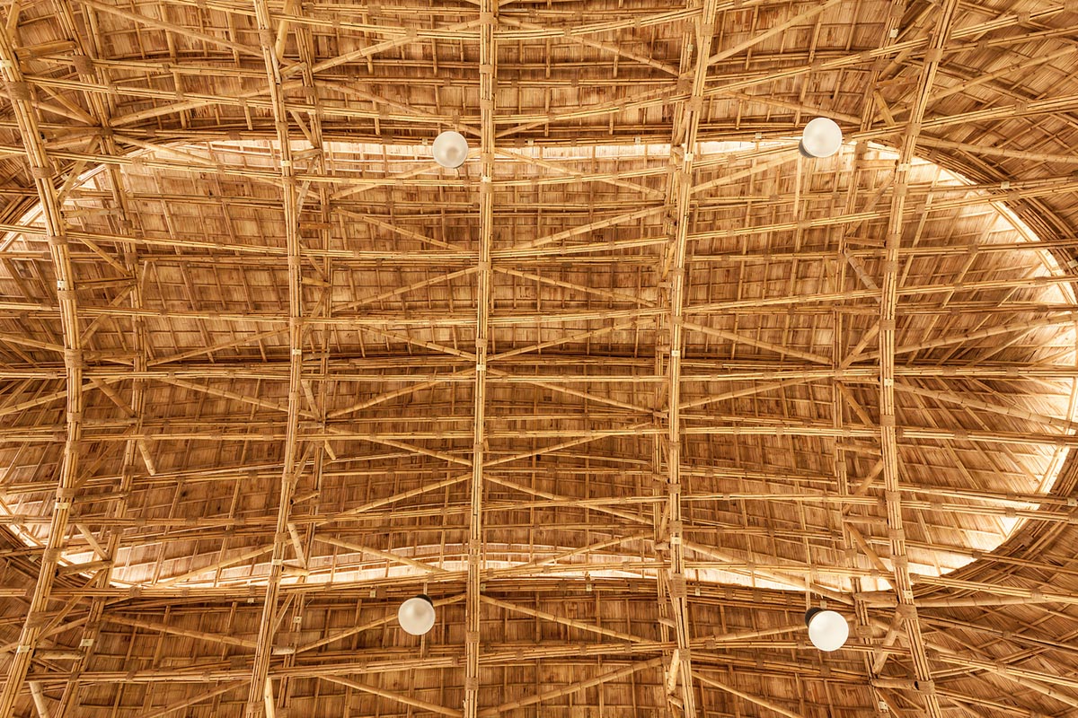 CLA used organic flowing curves with newly invented bamboo trusses for Bamboo Sports Hall in Thailand