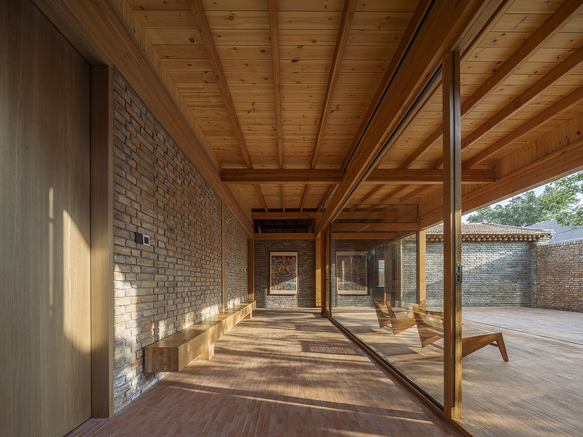 Archstudio renovates Beijing's old courtyard house with new wooden additions 