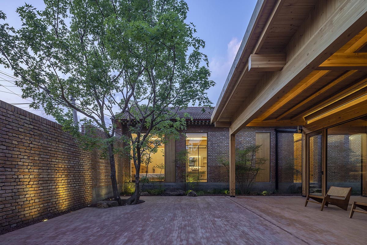 Archstudio renovates Beijing's old courtyard house with new wooden additions 