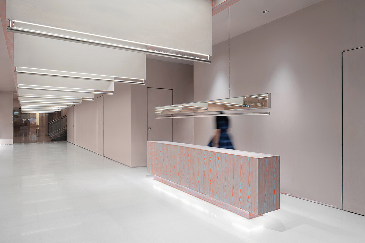Various Associates creates show-like and pink-hued fashion store under a viaduct in Chongqing