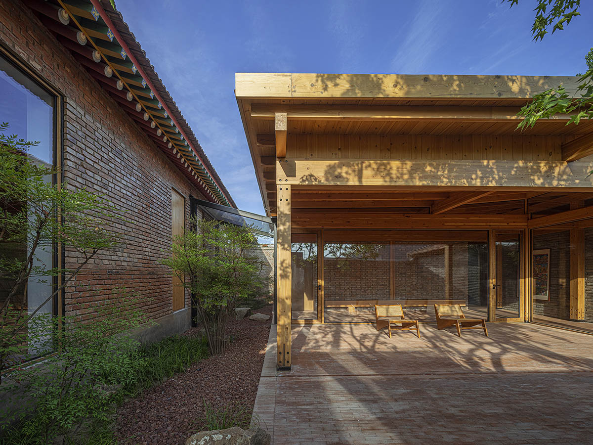 Archstudio renovates Beijing's old courtyard house with new wooden additions 