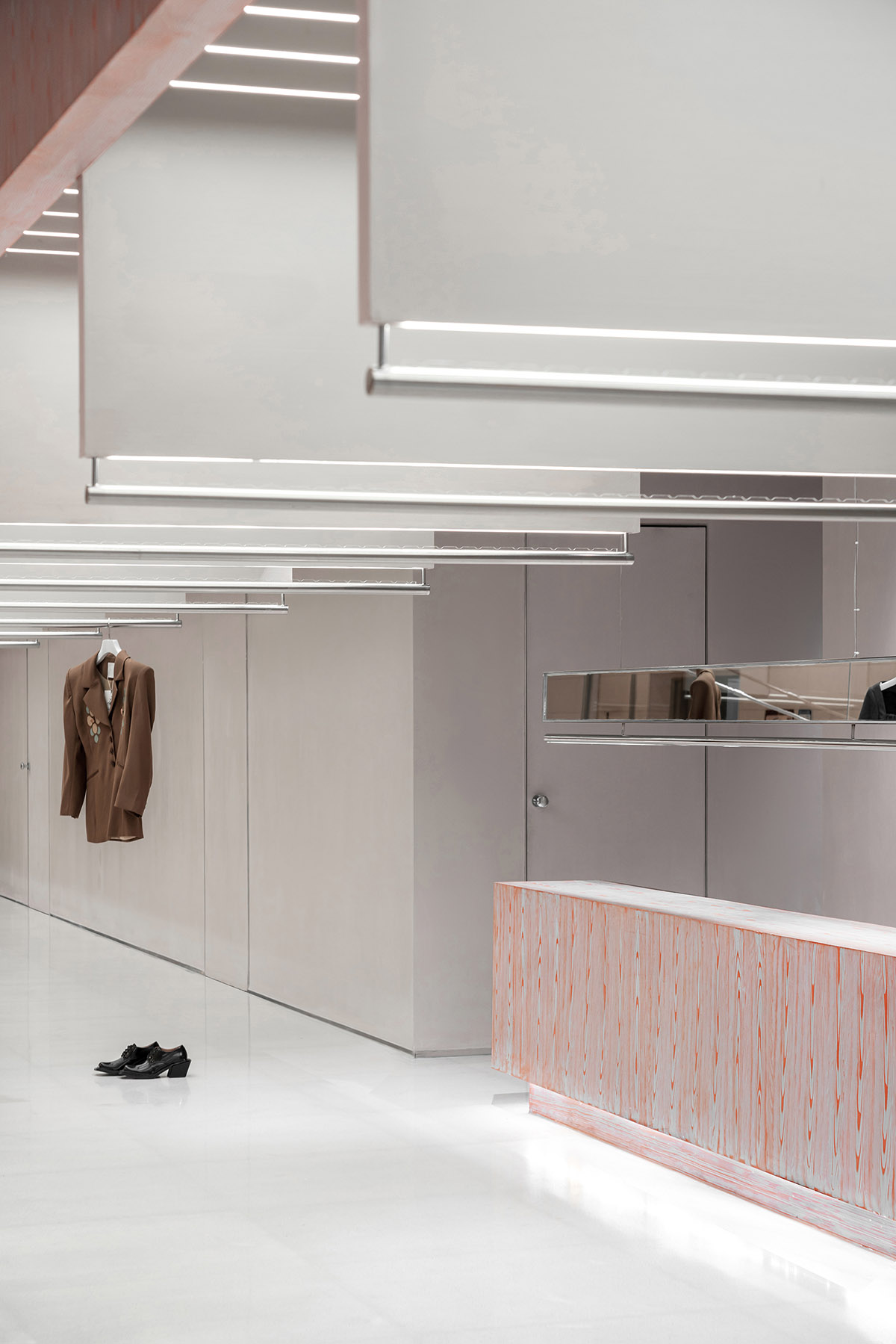 Various Associates creates show-like and pink-hued fashion store under a viaduct in Chongqing