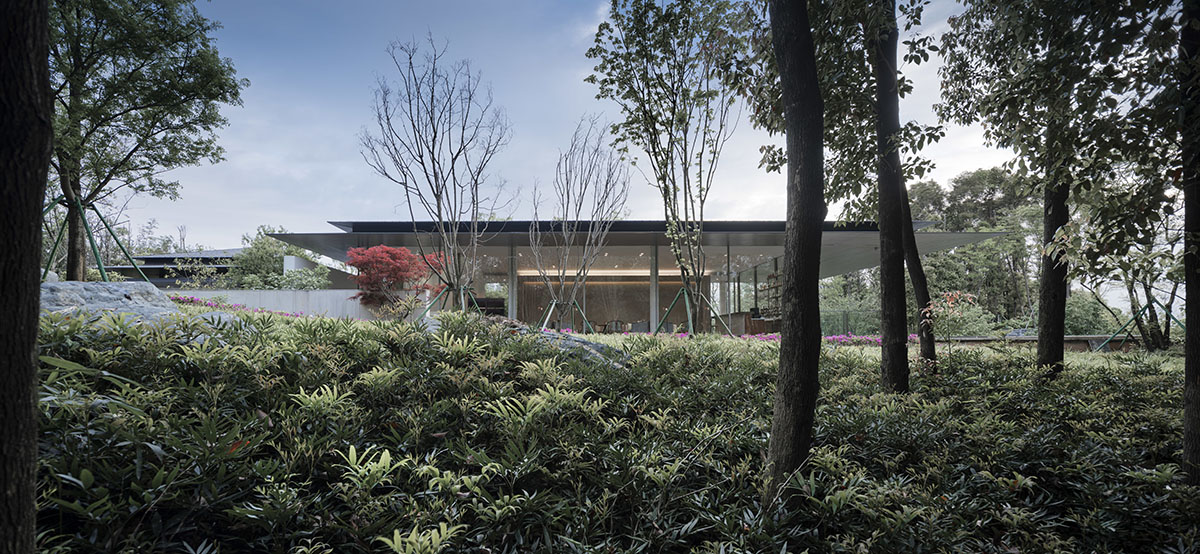 Hangzhou 9M Architectural Design embedded experience center with Large pieces of glasses in the hill