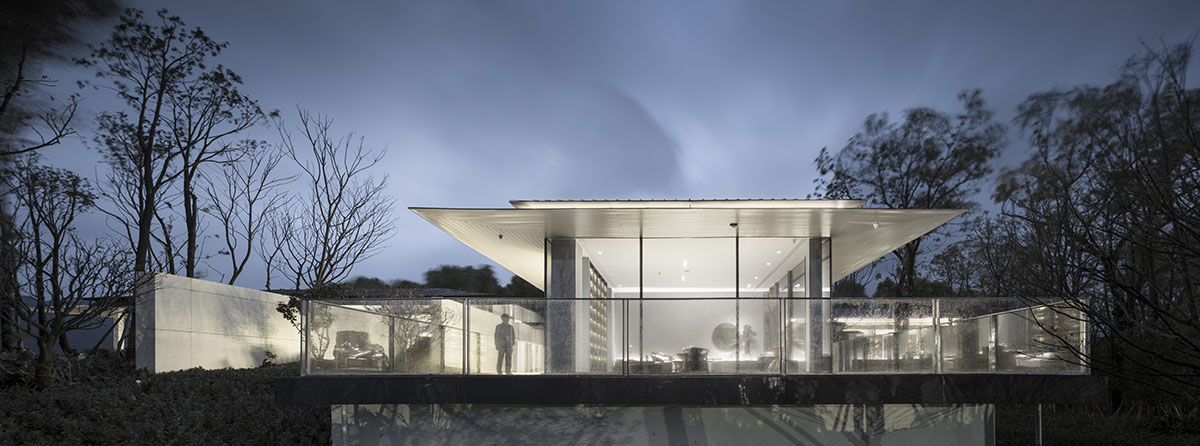 Hangzhou 9M Architectural Design embedded experience center with Large pieces of glasses in the hill