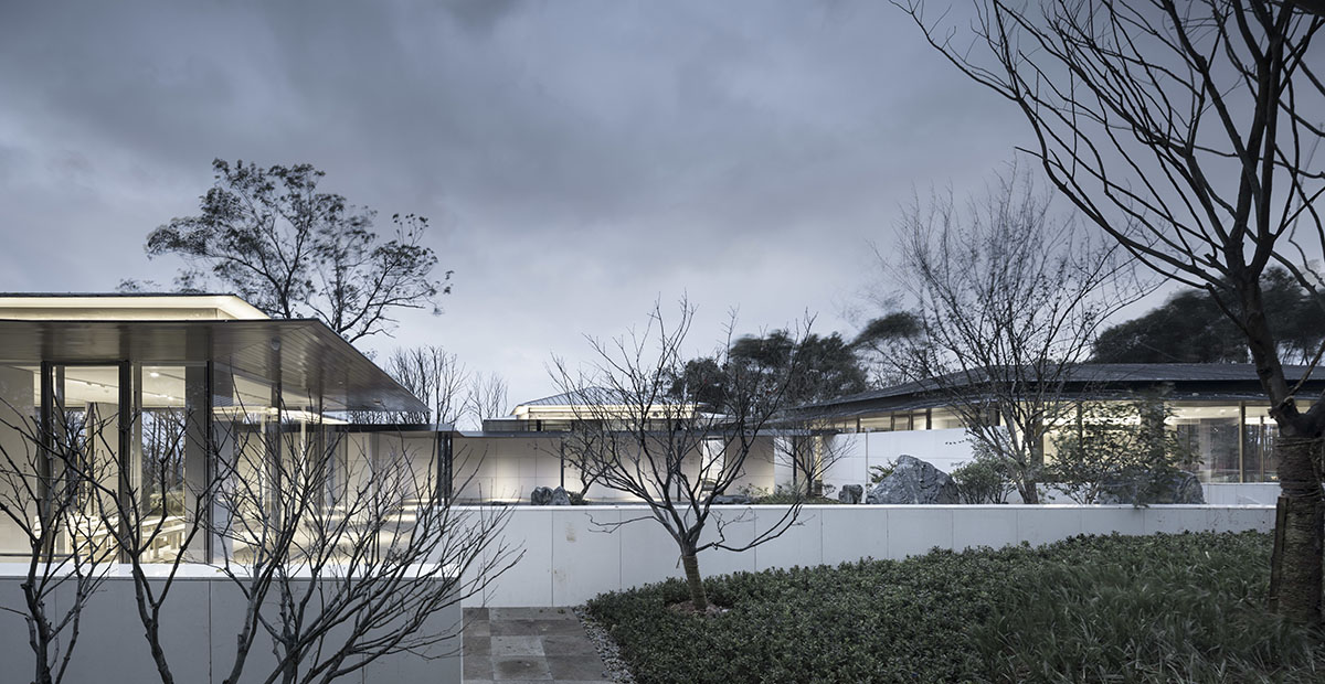 Hangzhou 9M Architectural Design embedded experience center with Large pieces of glasses in the hill