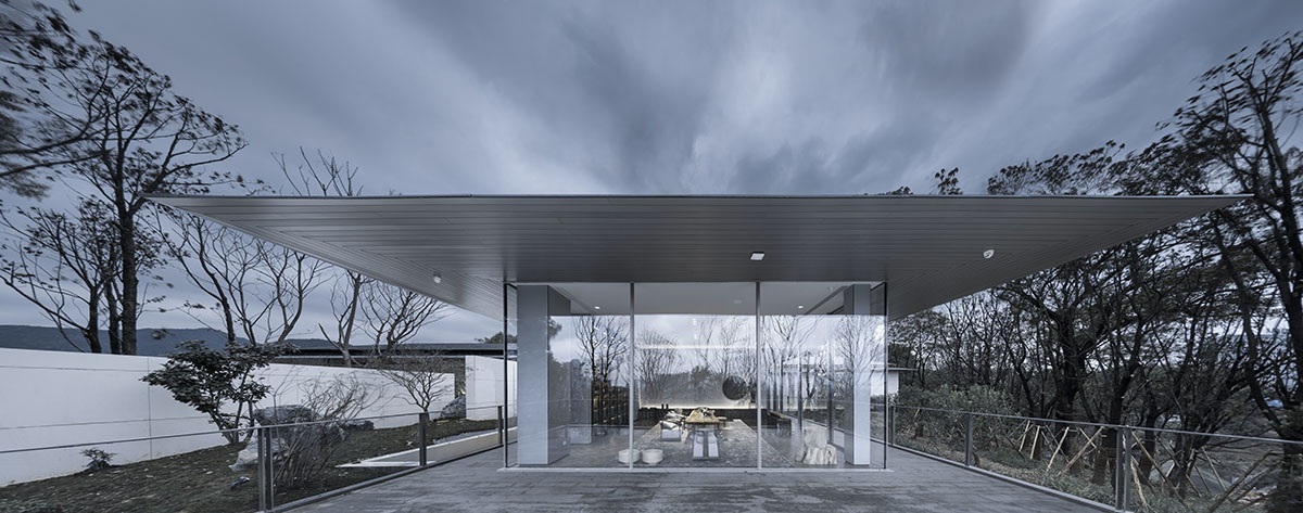 Hangzhou 9M Architectural Design embedded experience center with Large pieces of glasses in the hill