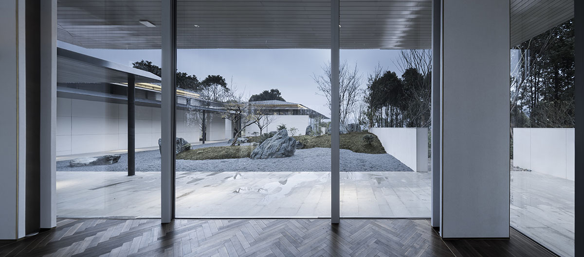 Hangzhou 9M Architectural Design embedded experience center with Large pieces of glasses in the hill