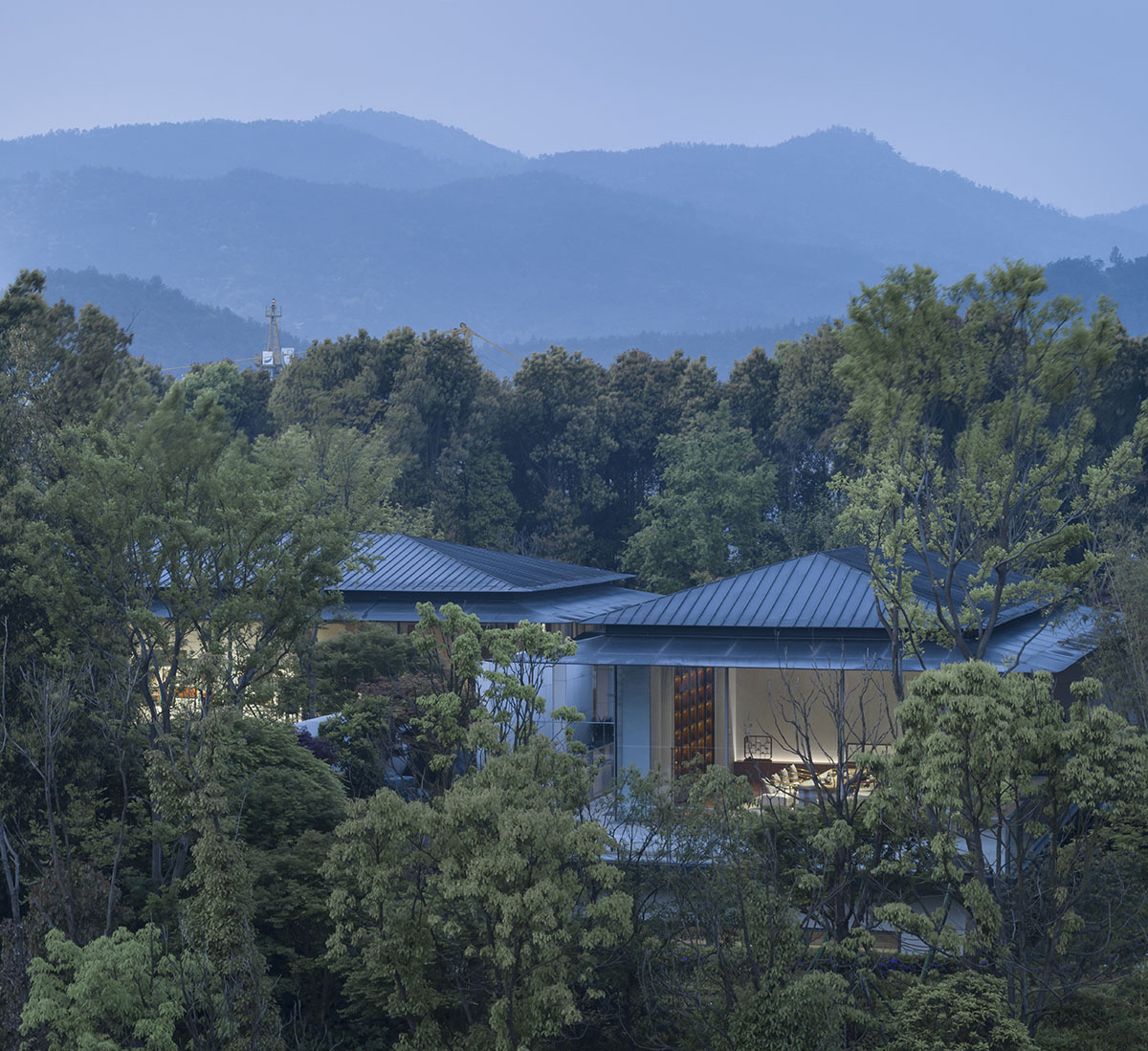 Hangzhou 9M Architectural Design embedded experience center with Large pieces of glasses in the hill