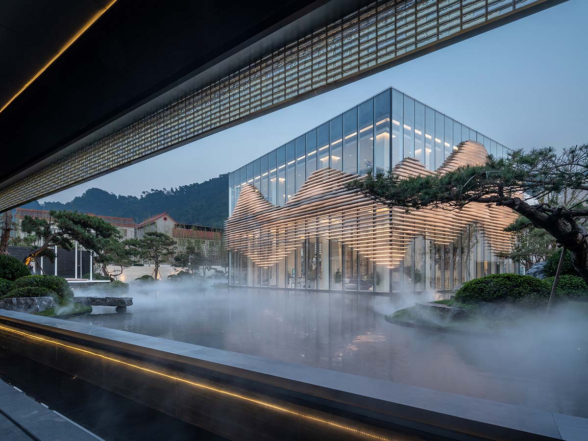 aoe wraps this sales pavilion with perforated plates that create a long scroll landscape painting