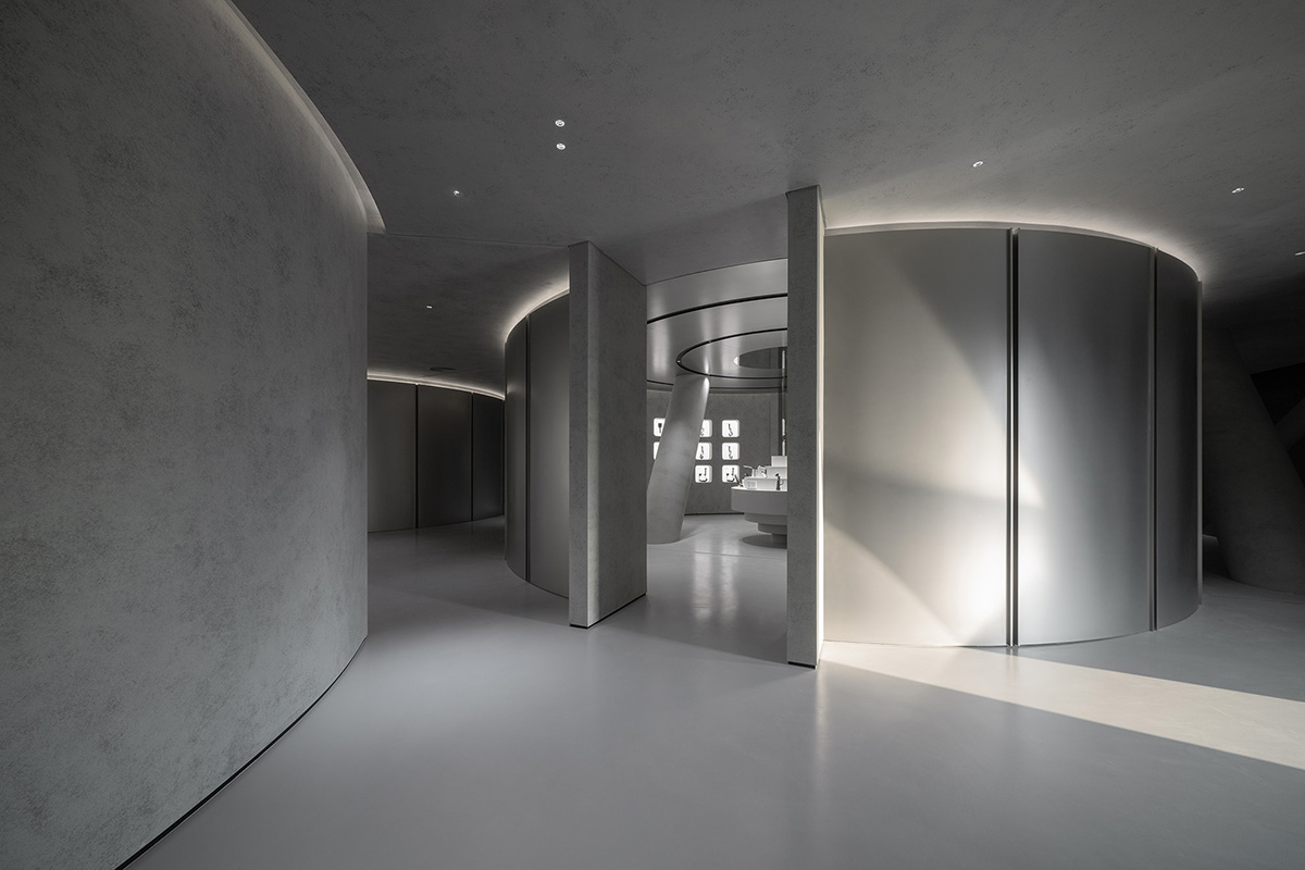 E Studio takes visitors into space travel with a flow of sculpted stainless steel for a showroom