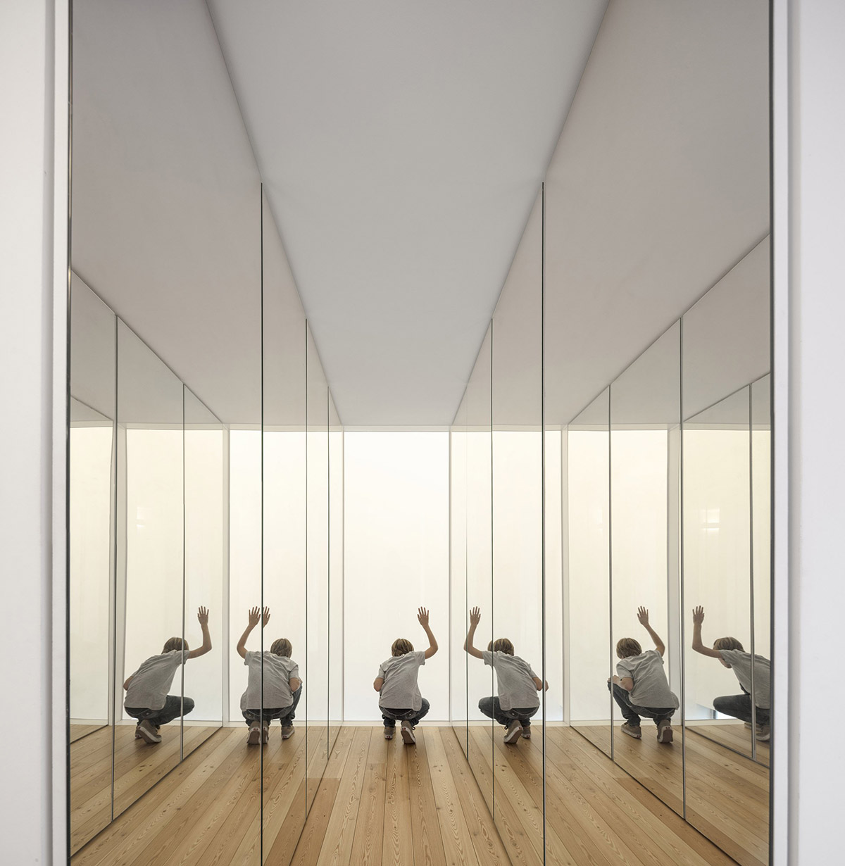 Extrastudio converted former winery in Portugal  into a new family home with red mortar walls