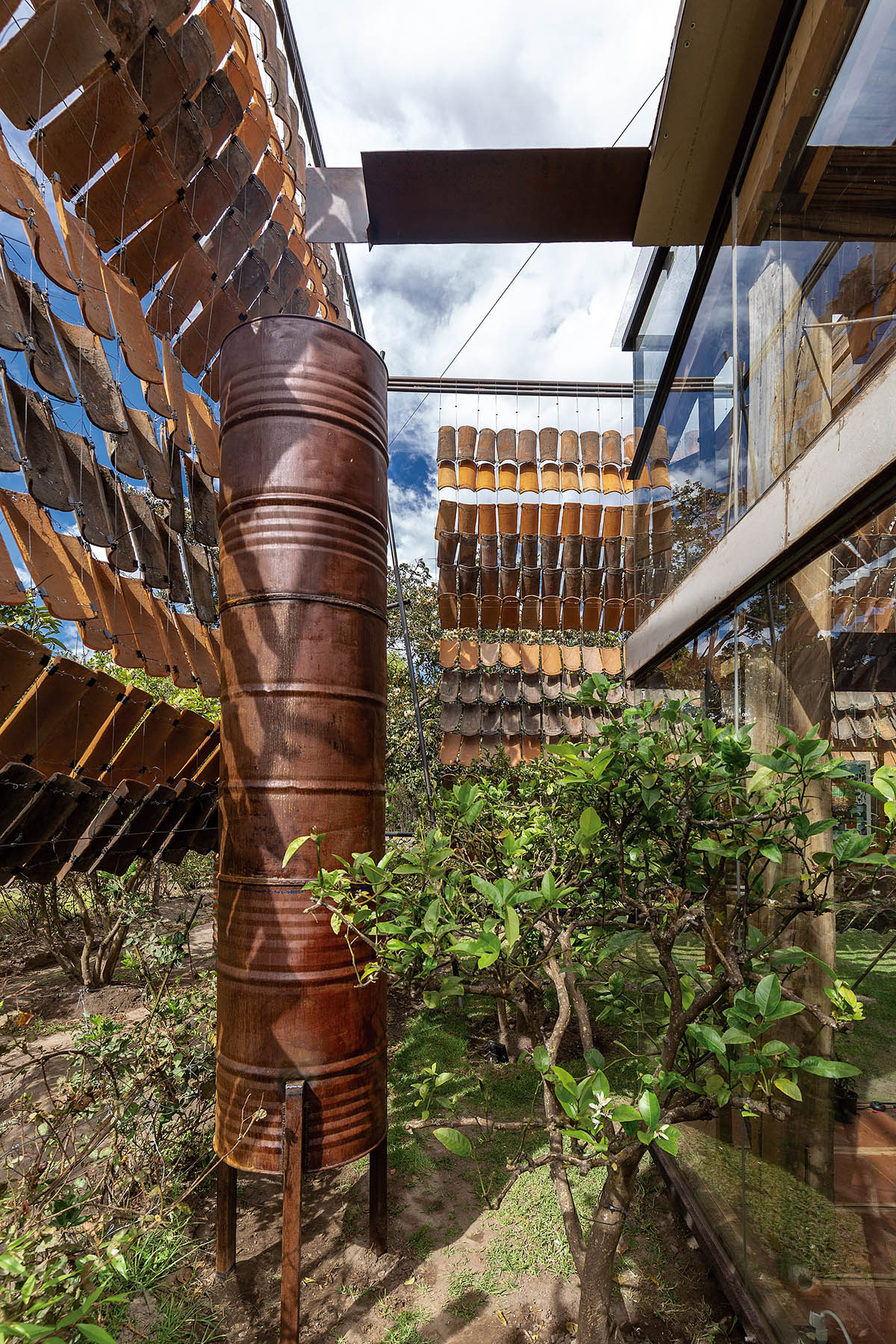 Daniel Moreno Flores creates welcoming screen with hanging tiles to mark this house in Ecuador