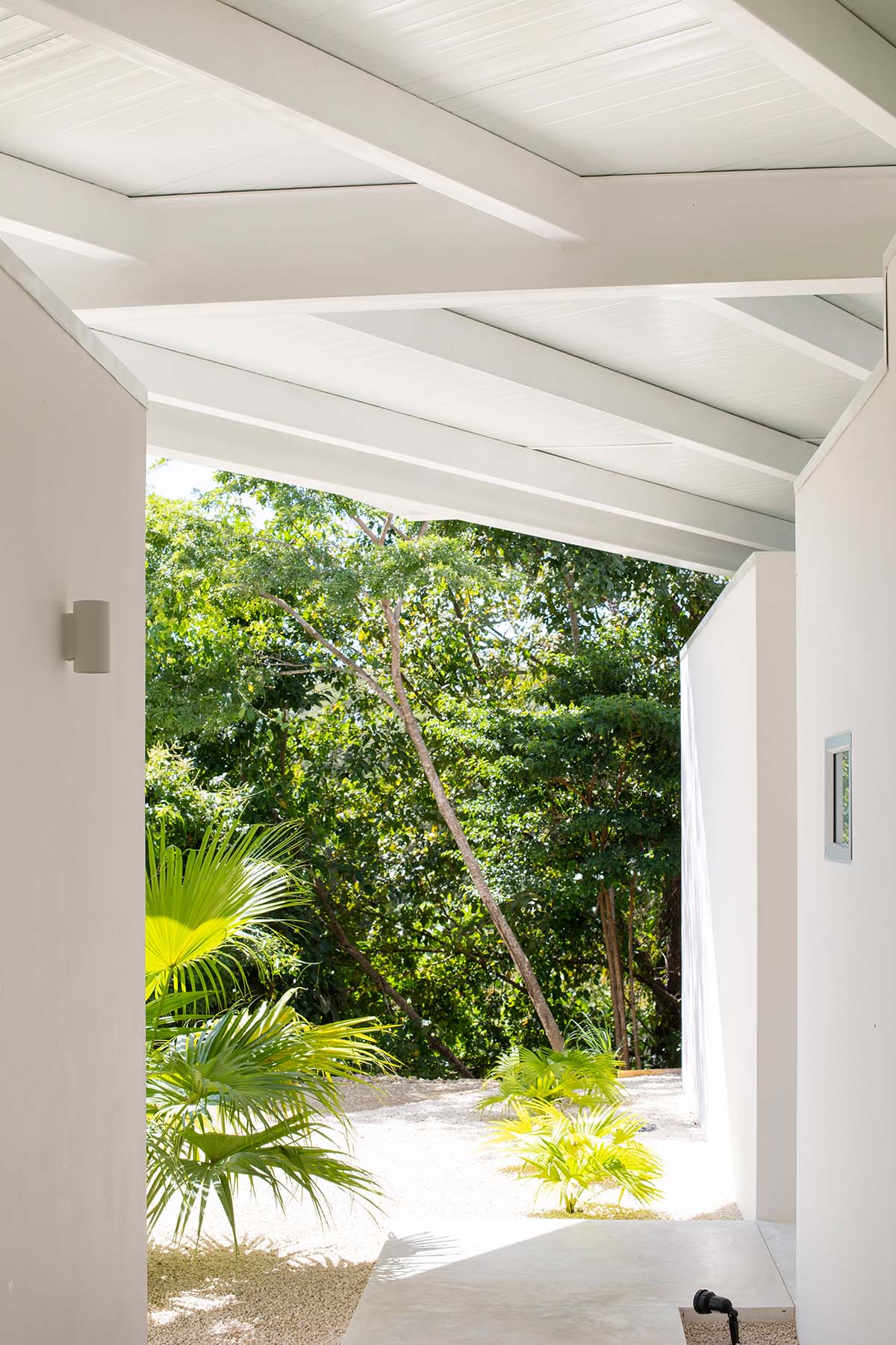 Large wing-like roof points out Santiago Hills Villa designed by Studio Saxe in Costa Rican jungle