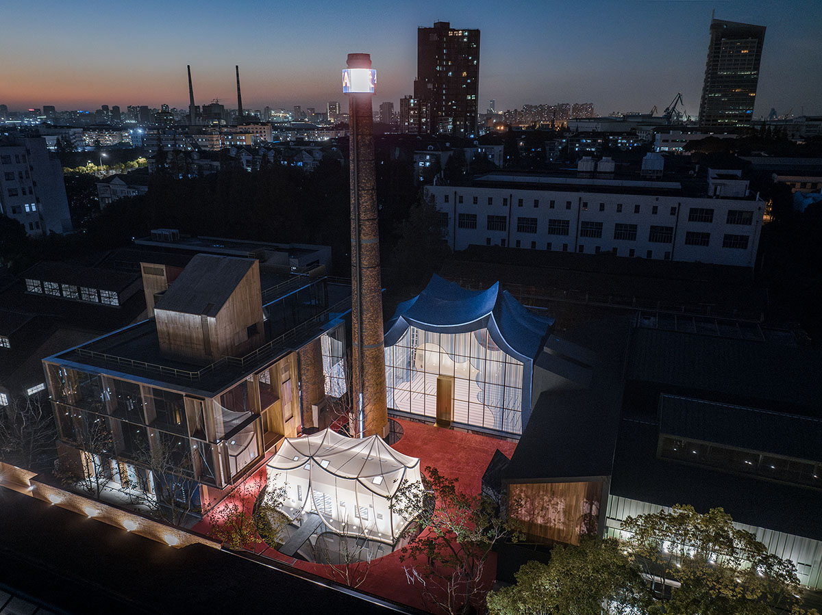 Wutopia Lab converts old roof-covered stockyard and duty room into wave-shaped community hub