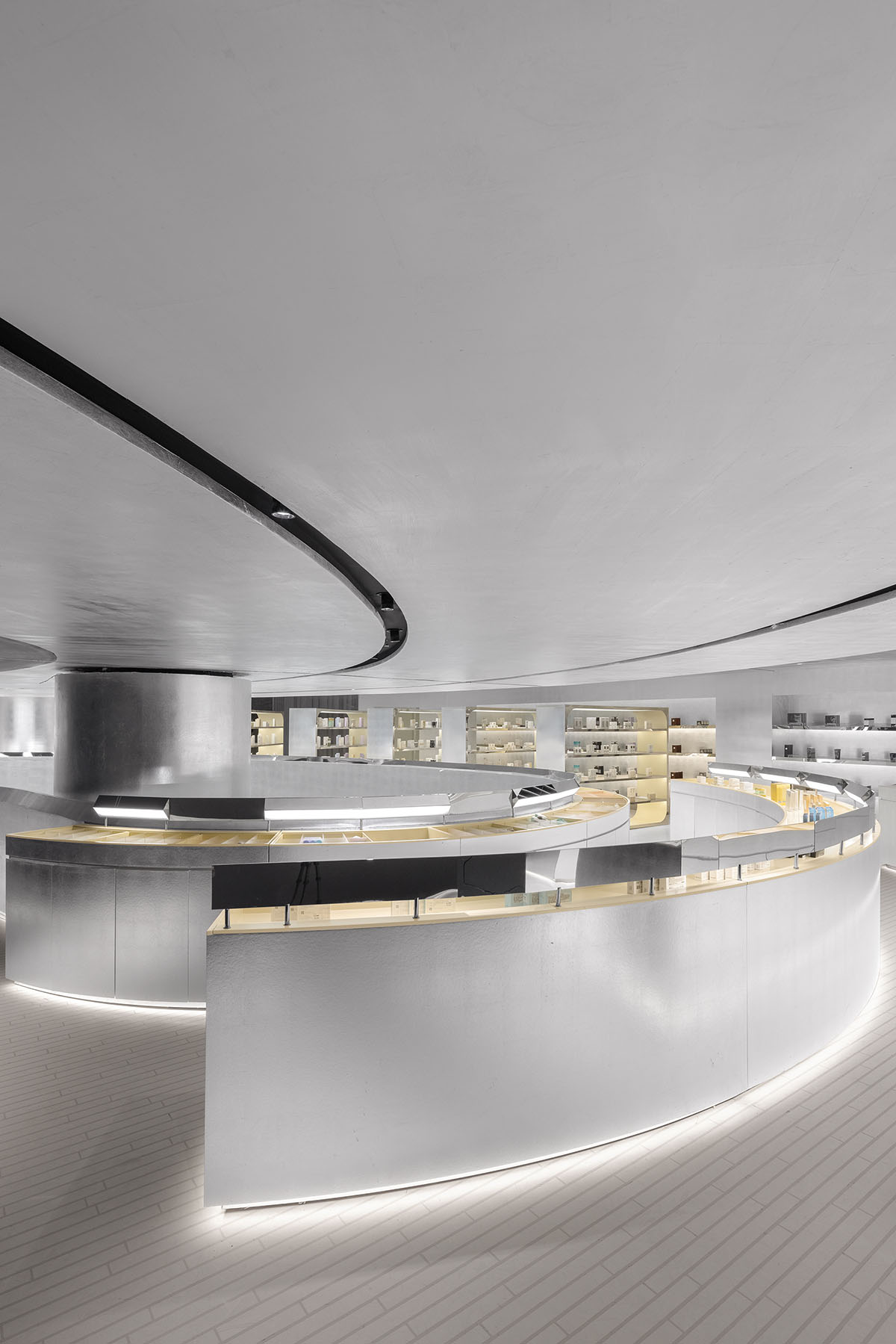 Various Associates designs beauty store with winding staircase and silver-toned interiors in Hangzhou