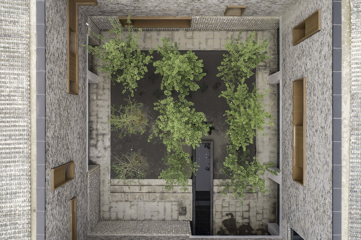 Neri&Hu clads cultural center with aluminum panels that soften heaviness of brick facade in Beijing