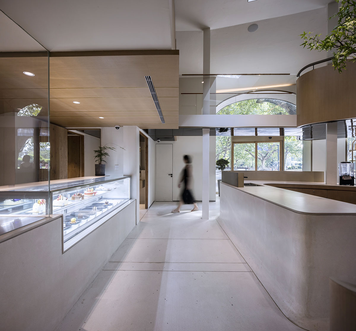 WJ Design combines dark facade with arched glass windows for pastry store in Hangzhou