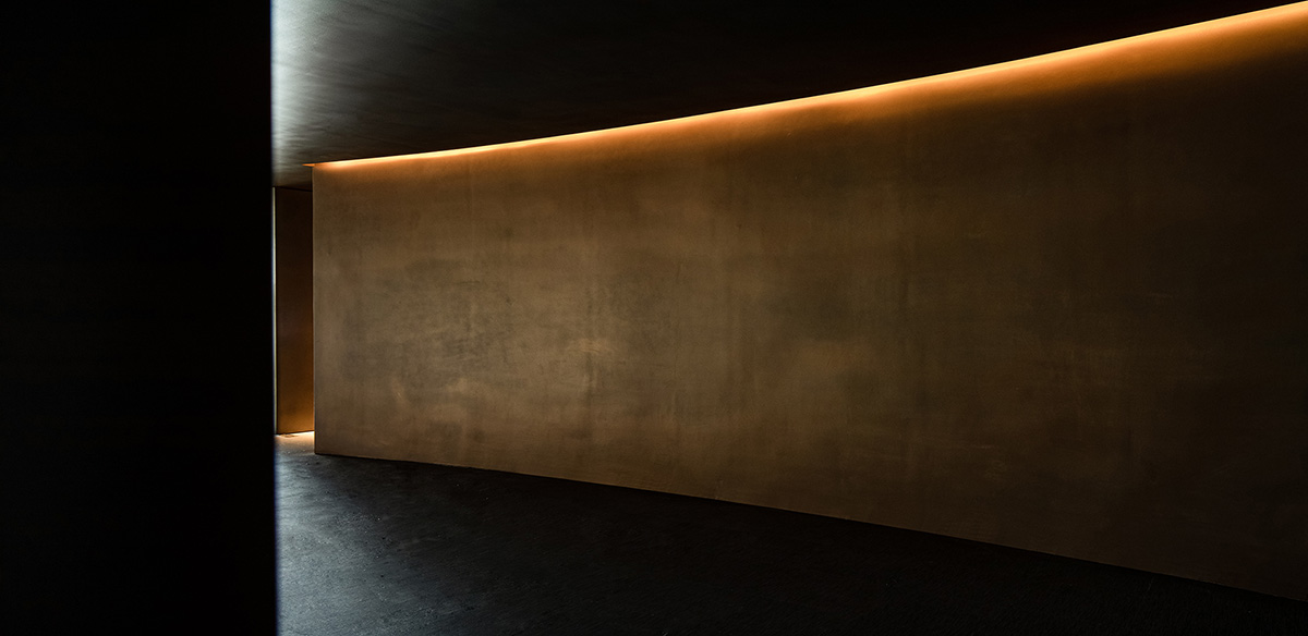 AD ARCHITECTURE designs restaurant with dark and cozy interiors in Shenzhen