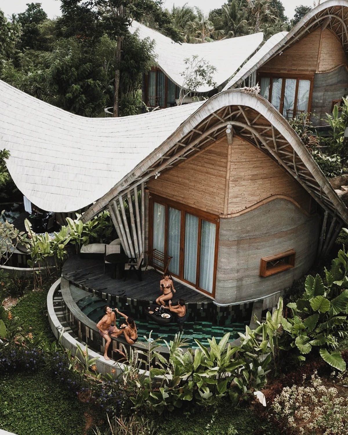 Undulating bamboo roofs wrap this wellness retreat in a lush forest of Bali