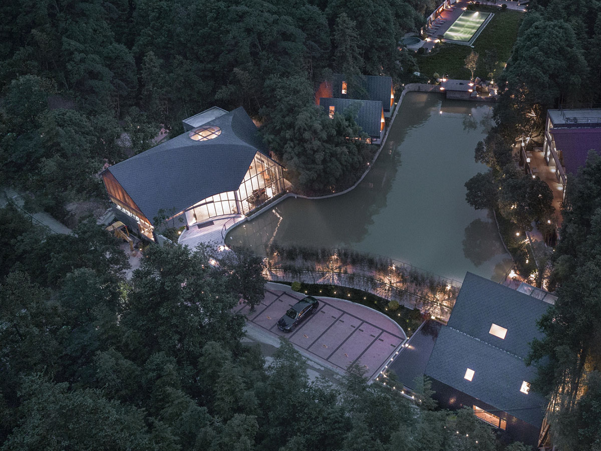Wildurban Architects completes restaurant with cave-like roof in a forest in Huizhou, China