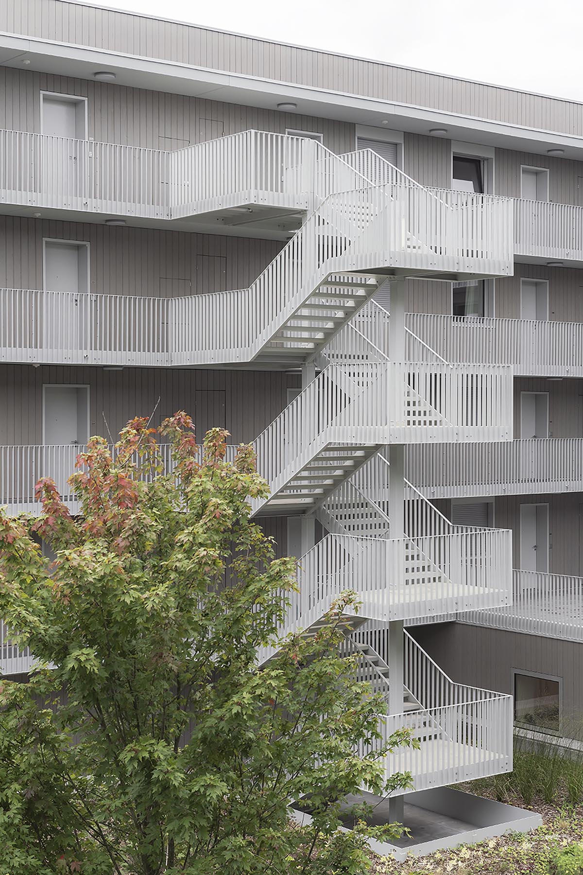 KAAN Architecten completes a compact mixed-use building with a domestic ...