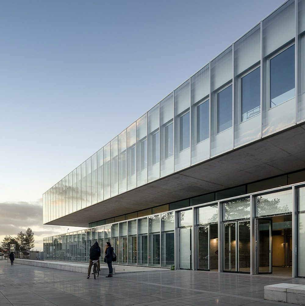 KAAN Architecten and PDAA built monolithic glazed CMA headquarters in Lille