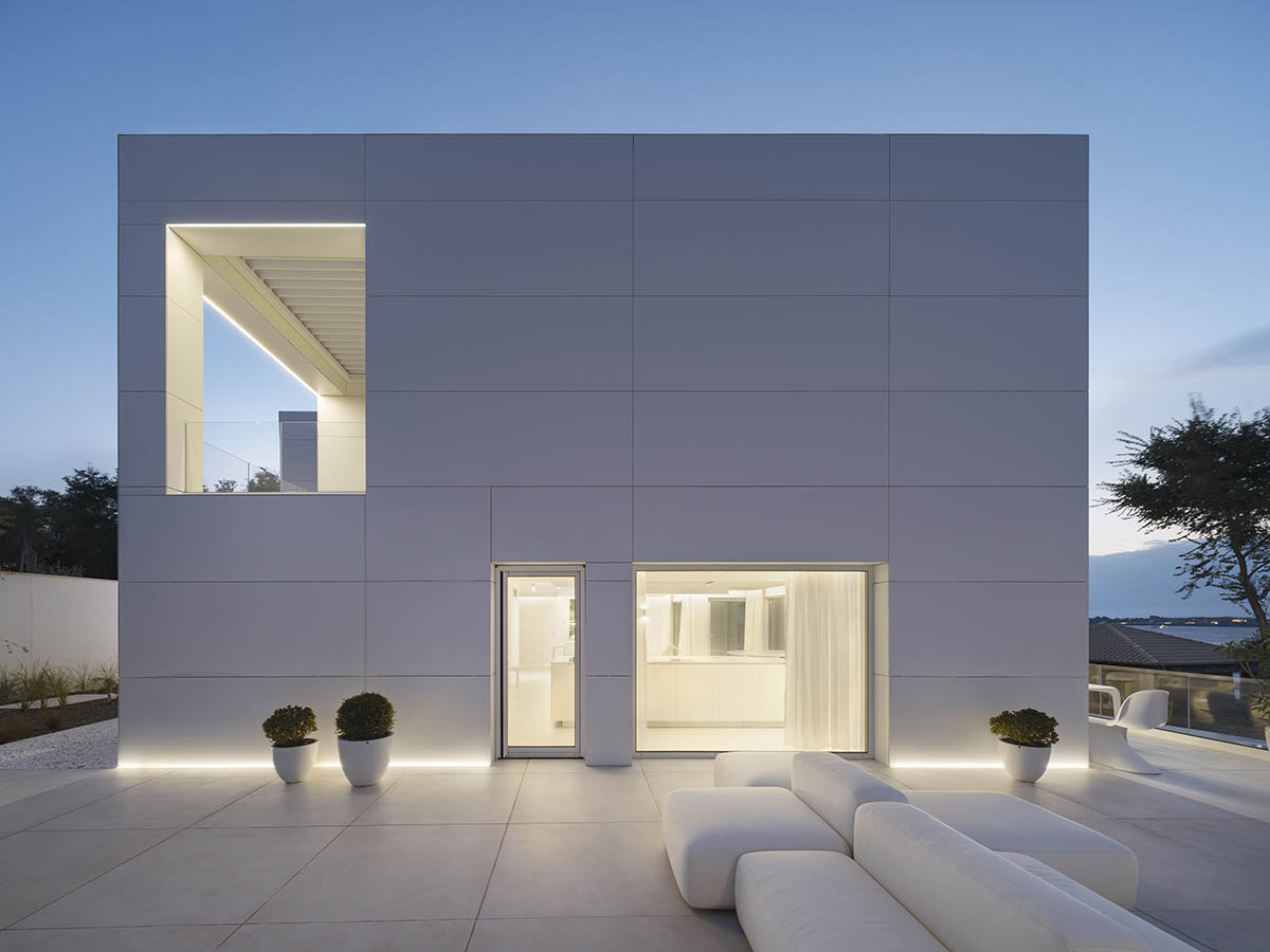 Simple Architecture renovates old house with gridded fa&ccedil;ade in Bulgaria