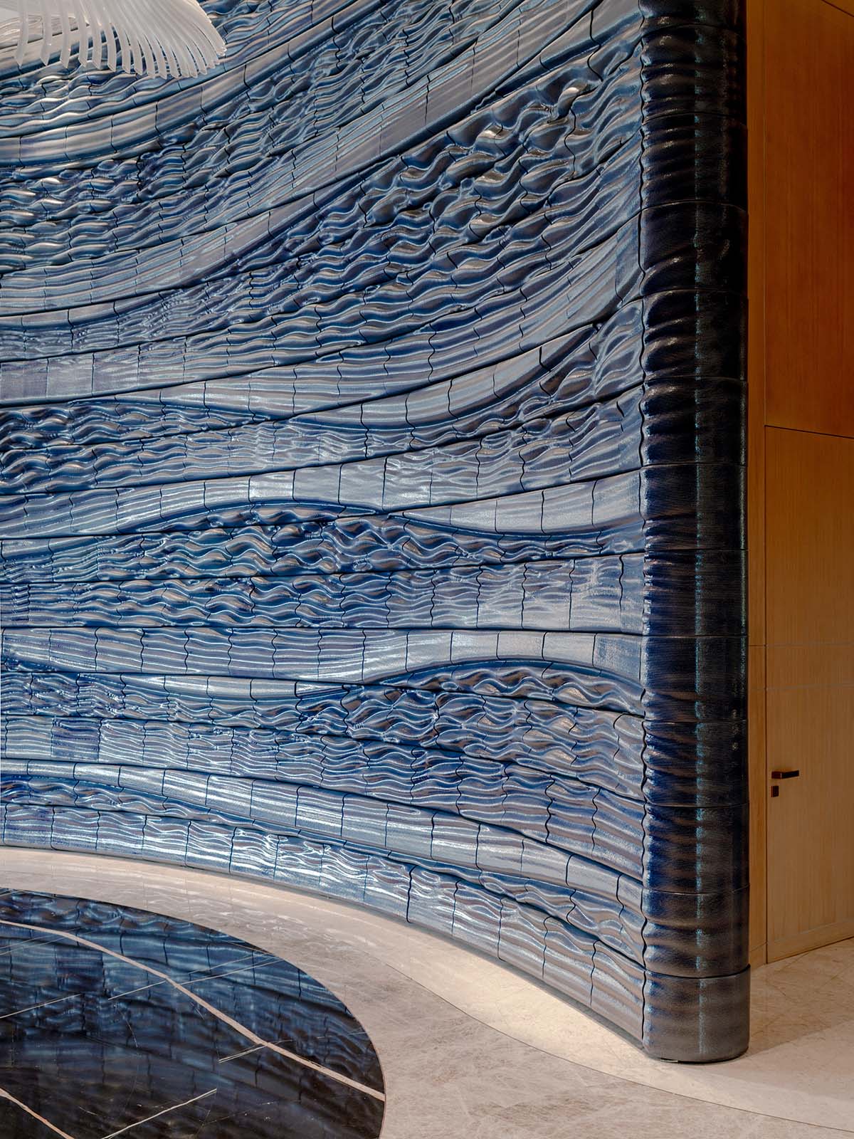 Studio RAP wraps the entrance of a hotel with majestic 3D printed ceramic walls 