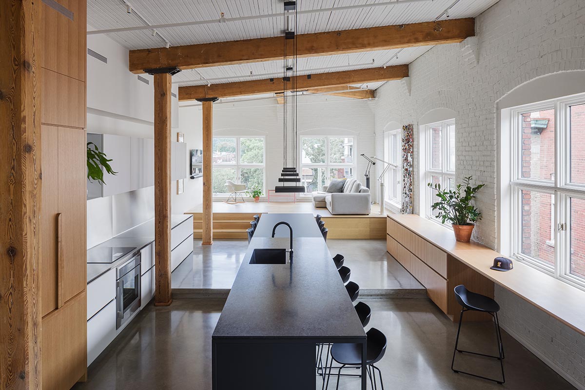 La Firme renovates historic mid-19th-century building with brick walls and oak cabinets in Montreal 