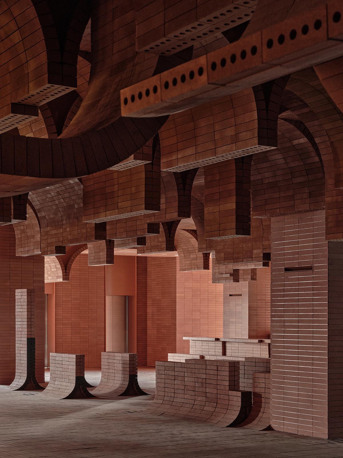 One Plus Partnership adds layered bricks to a cinema interior to resemble waves in Haikou