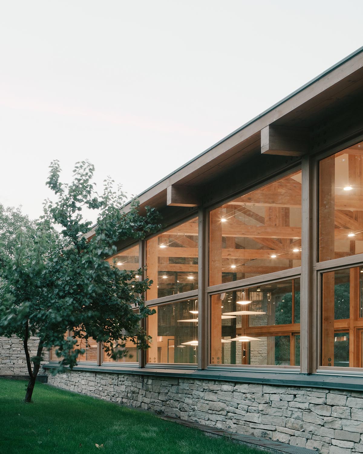 The stone and wood Tbilisi residence integrates architecture with the natural landscape