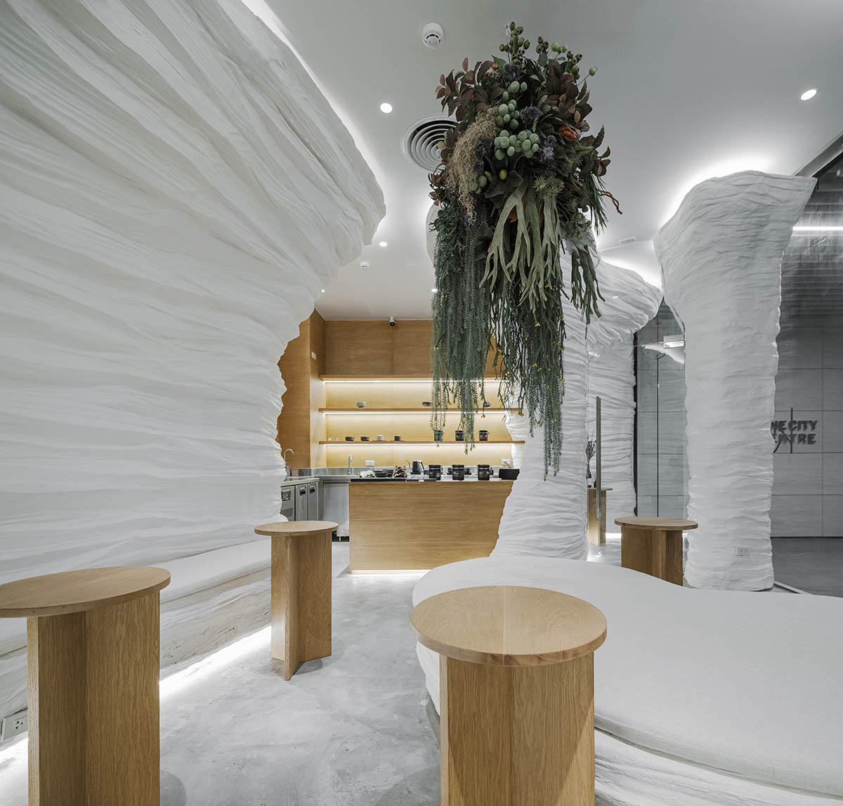 Juti architects creates surreal atmosphere for tea house within cave-like and textured walls 