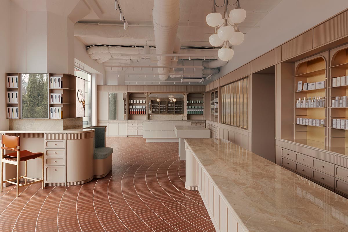 Odami enriches the interiors of a beauty shop with rounded, bevelled details, and pinkish hues
