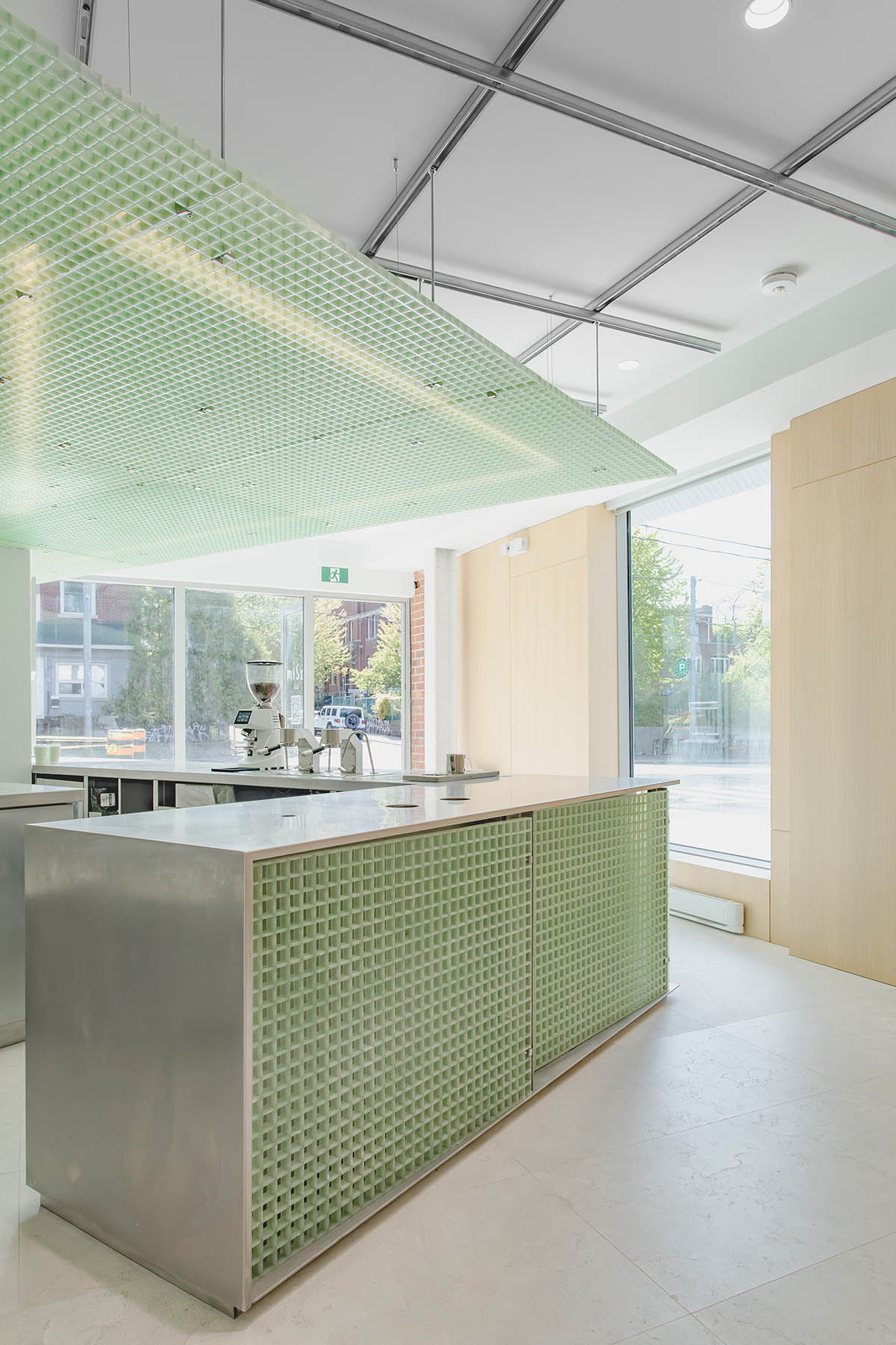 Misc Coffee makes a bold statement with green translucent bar in a busy street of Toronto