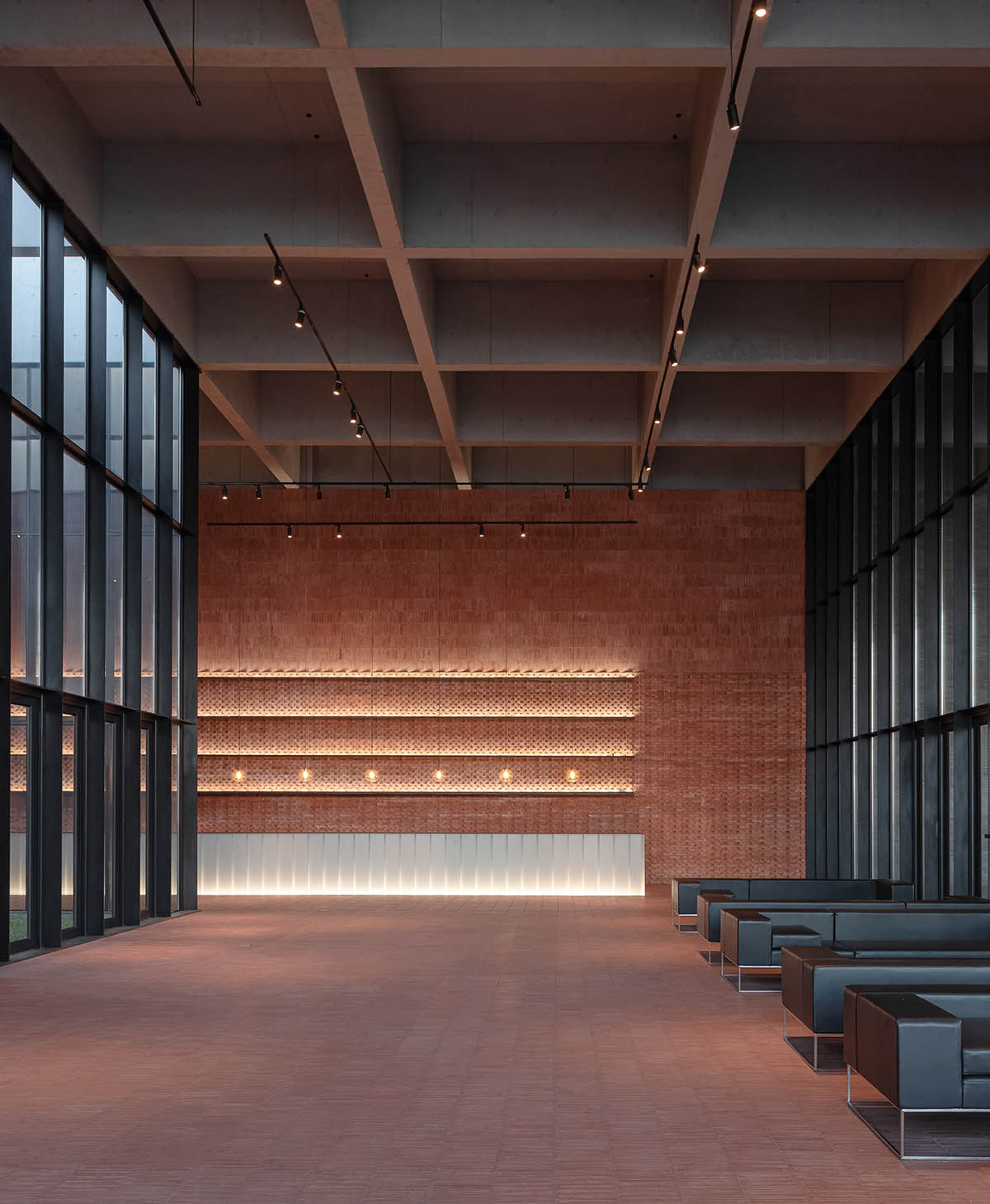 Grey brick walls wrap a factory building referencing to local construction methods in China 