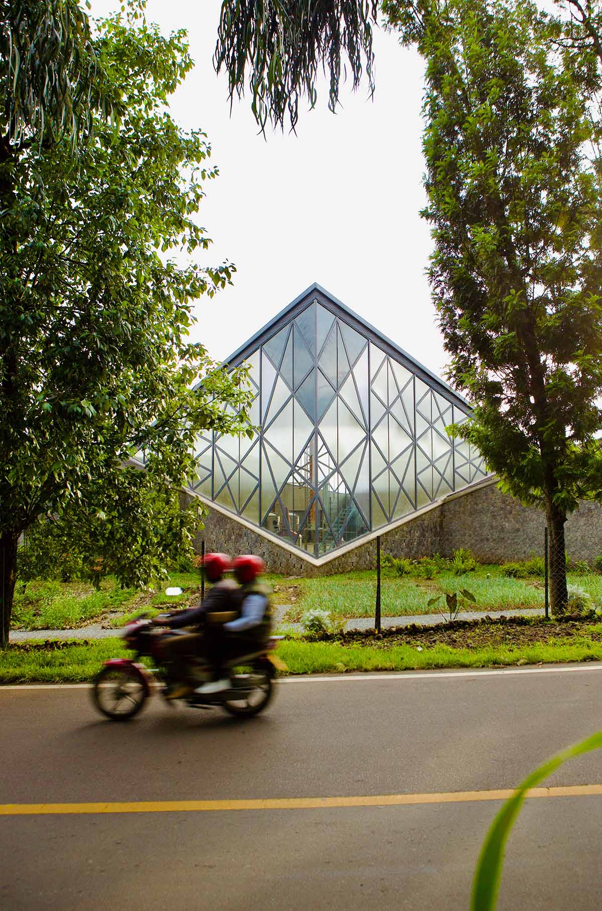 Striking geometric glass geometry resembles an open eye at a distillery in Rwanda