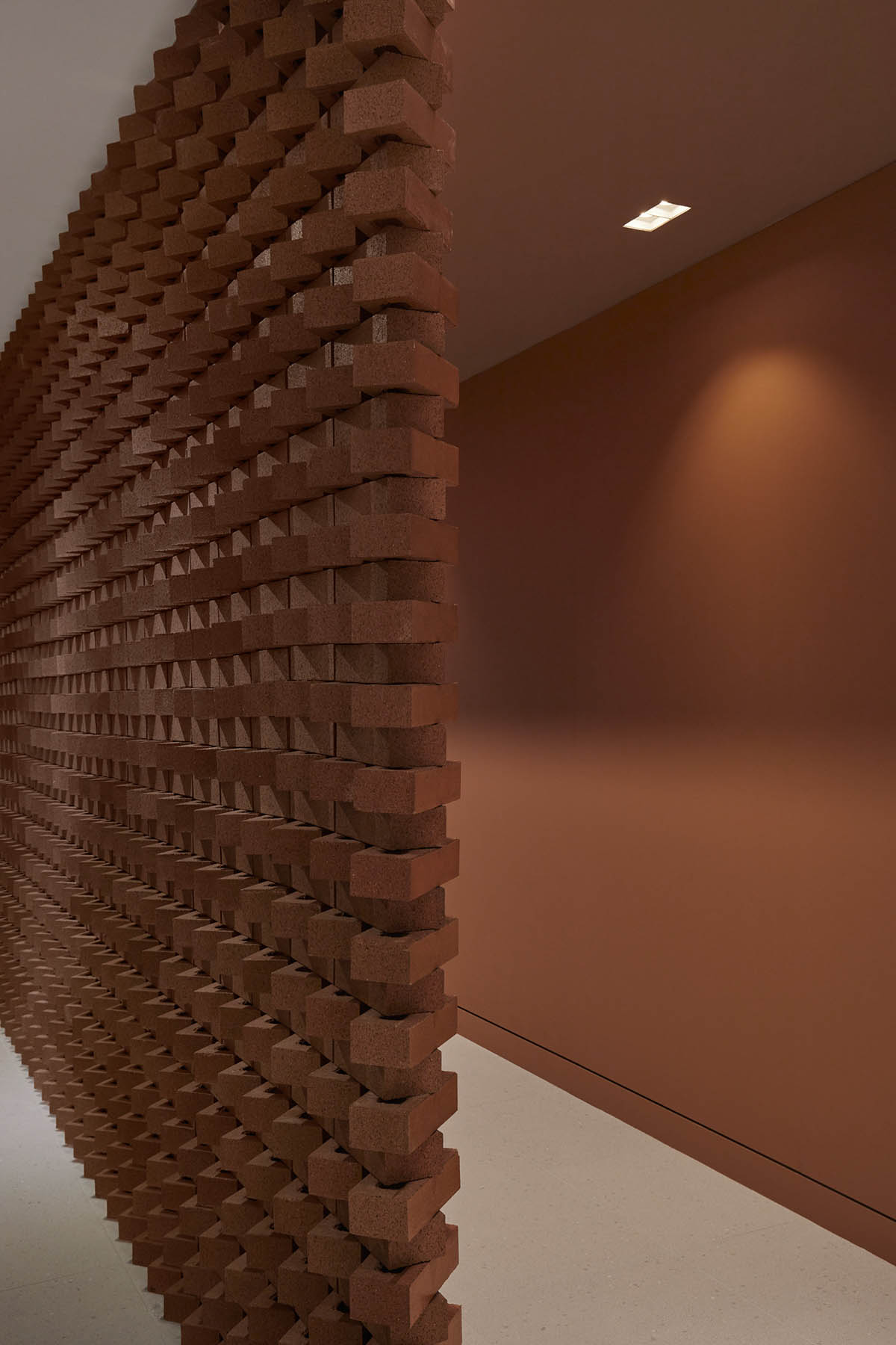 Surgical center features artisanal terracotta brick wall to reverse 