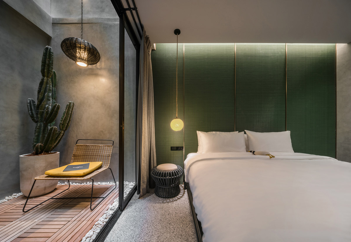 SIM Studio converts old shophouse into a boutique hotel by wrapping with steel exoskeleton in Bangkok