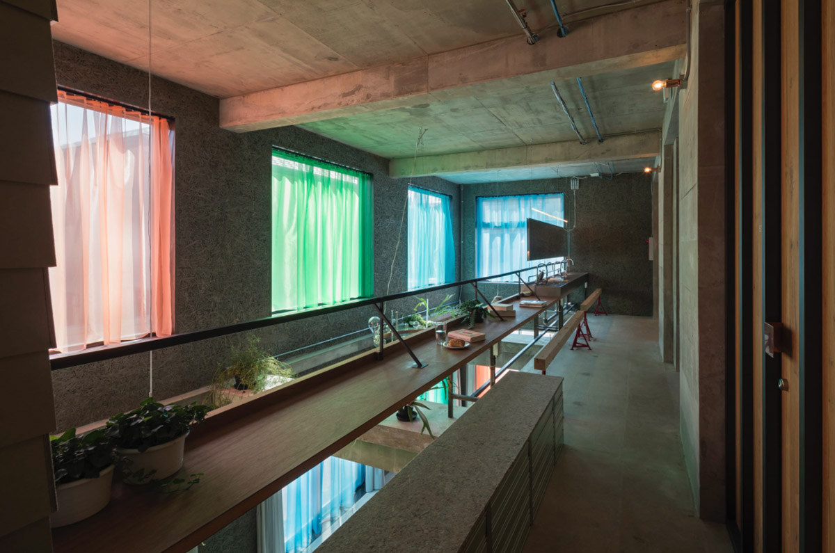 Tato Architects creates painted effect to this concrete hotel by using colourful curtains in Osaka