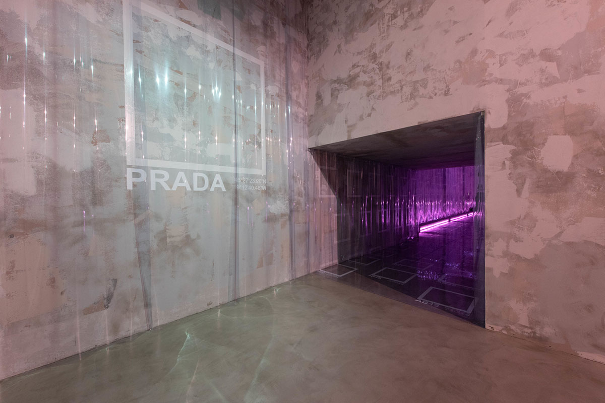 AMO filled Prada's fashion show stage with purple-lit inflatable stools