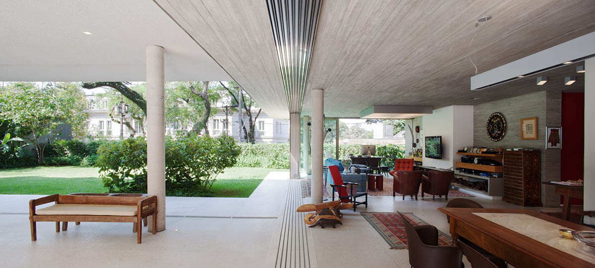 Perkins+Will's Cidade Jardim House features a large garden space under thin columns