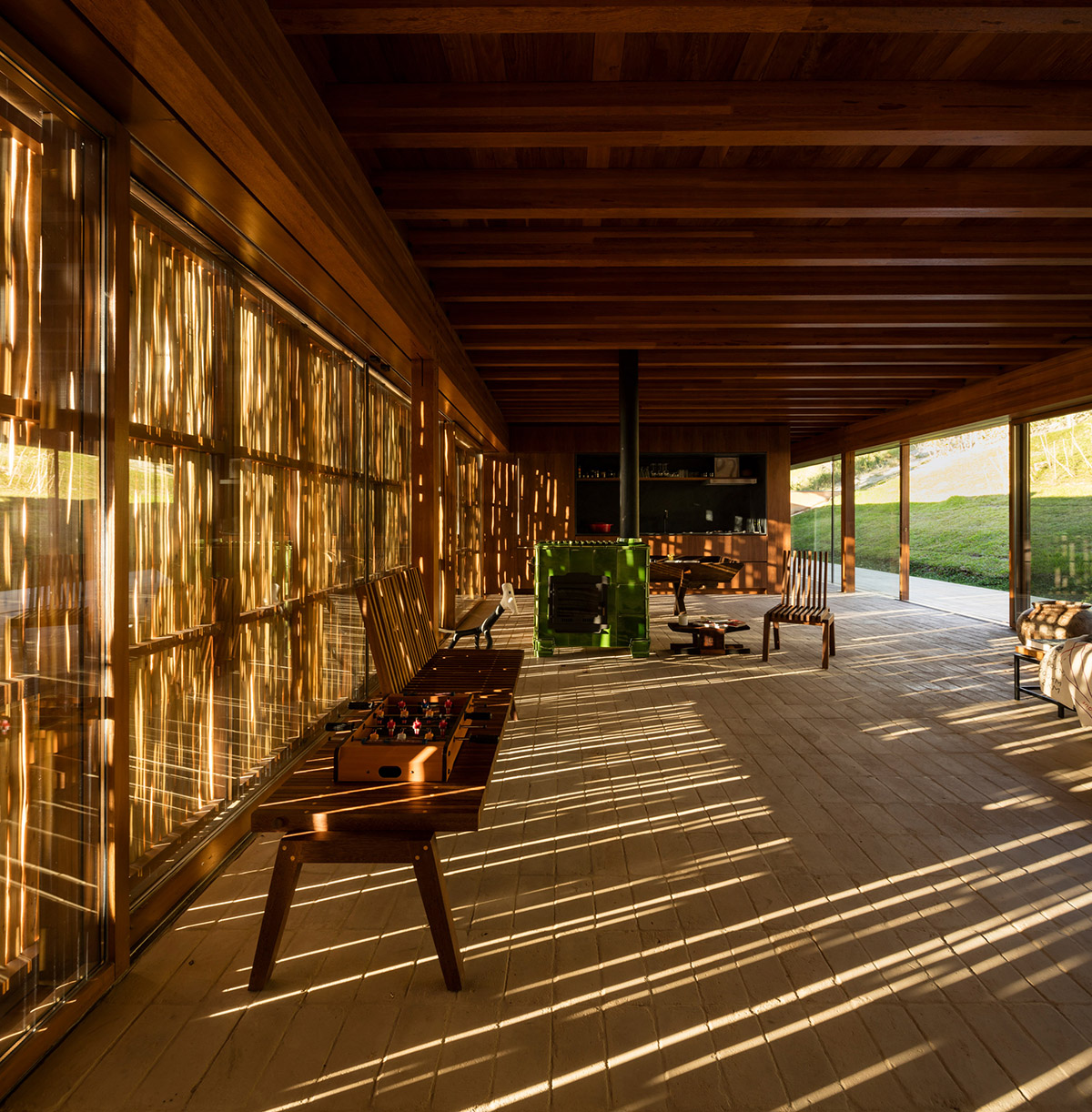 Narrow wooden Catu&ccedil;aba House by Studio MK27 produces its own energy on a valley of S&atilde;o Paulo