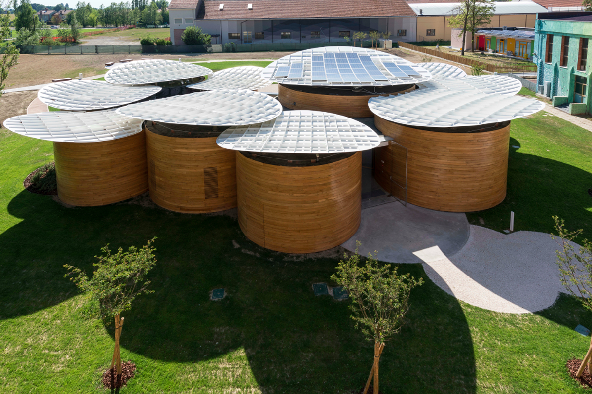 Nine wooden circular music boxes by MCA placed on the former Lamborghini manufacturing site in Italy