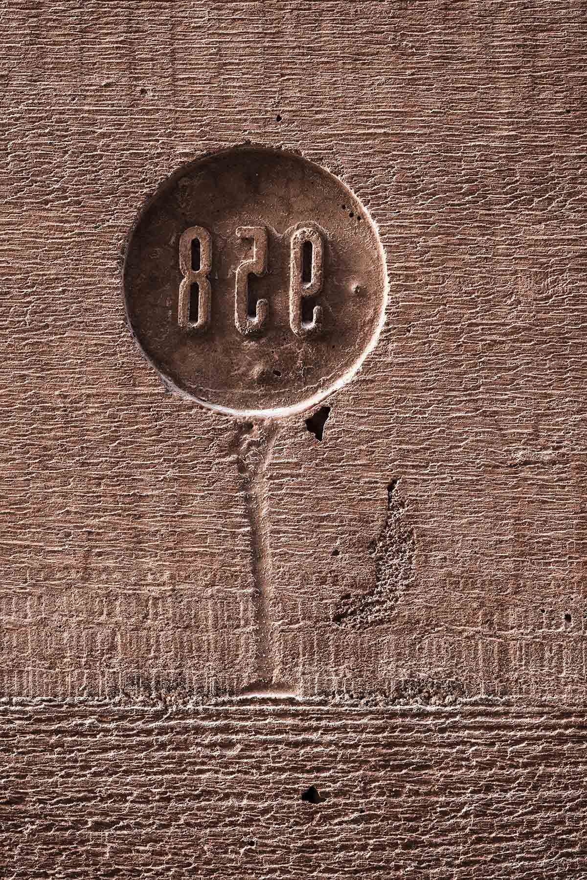 BBGK Architekci designed 12-metre-high stained concrete wall to narrate victims for Katyn Museum