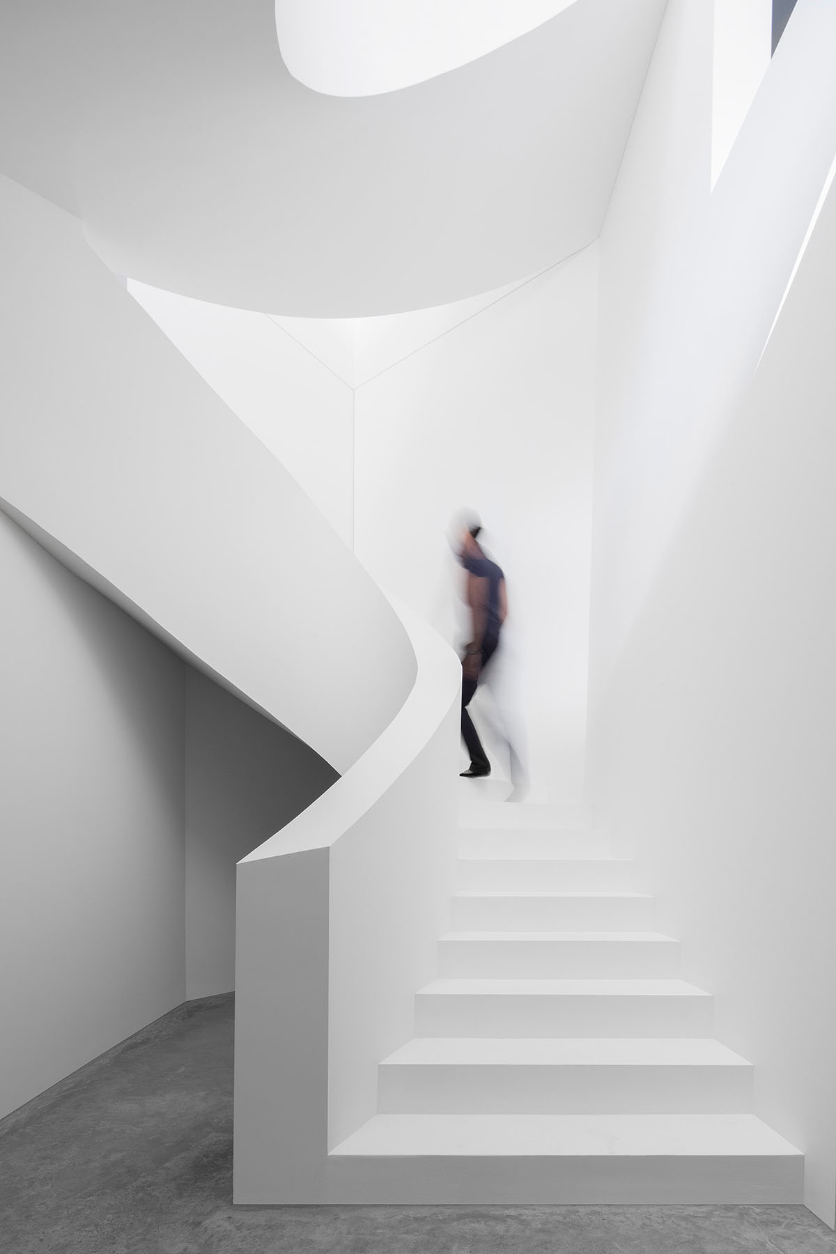 Grey concrete villa by DF_DC is characterised with trapezoidal colonnaded terrace on Comano hills