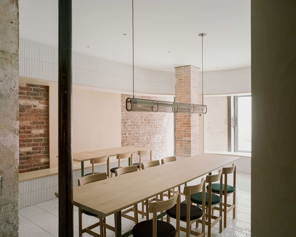 Neri&Hu-designed restaurant in Paris exposes layering material history with oblong volume inside