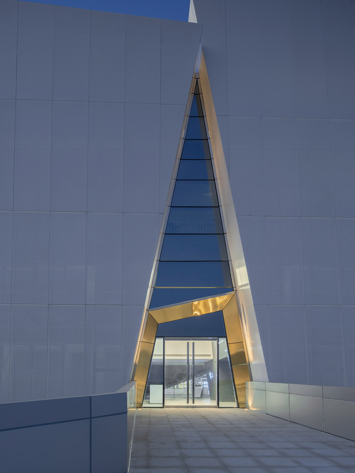 aoe built ShuiFa Info Town Property Exhibition Centre with all-white perforated volumes in China