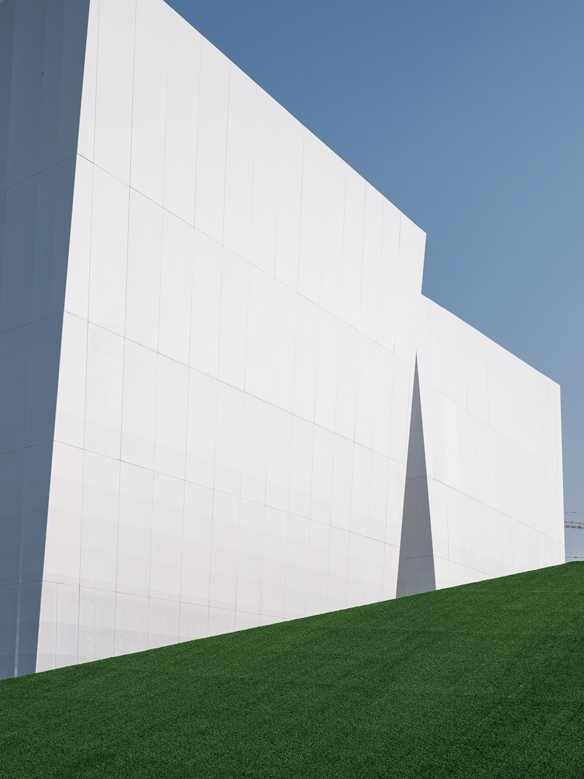 aoe built ShuiFa Info Town Property Exhibition Centre with all-white perforated volumes in China