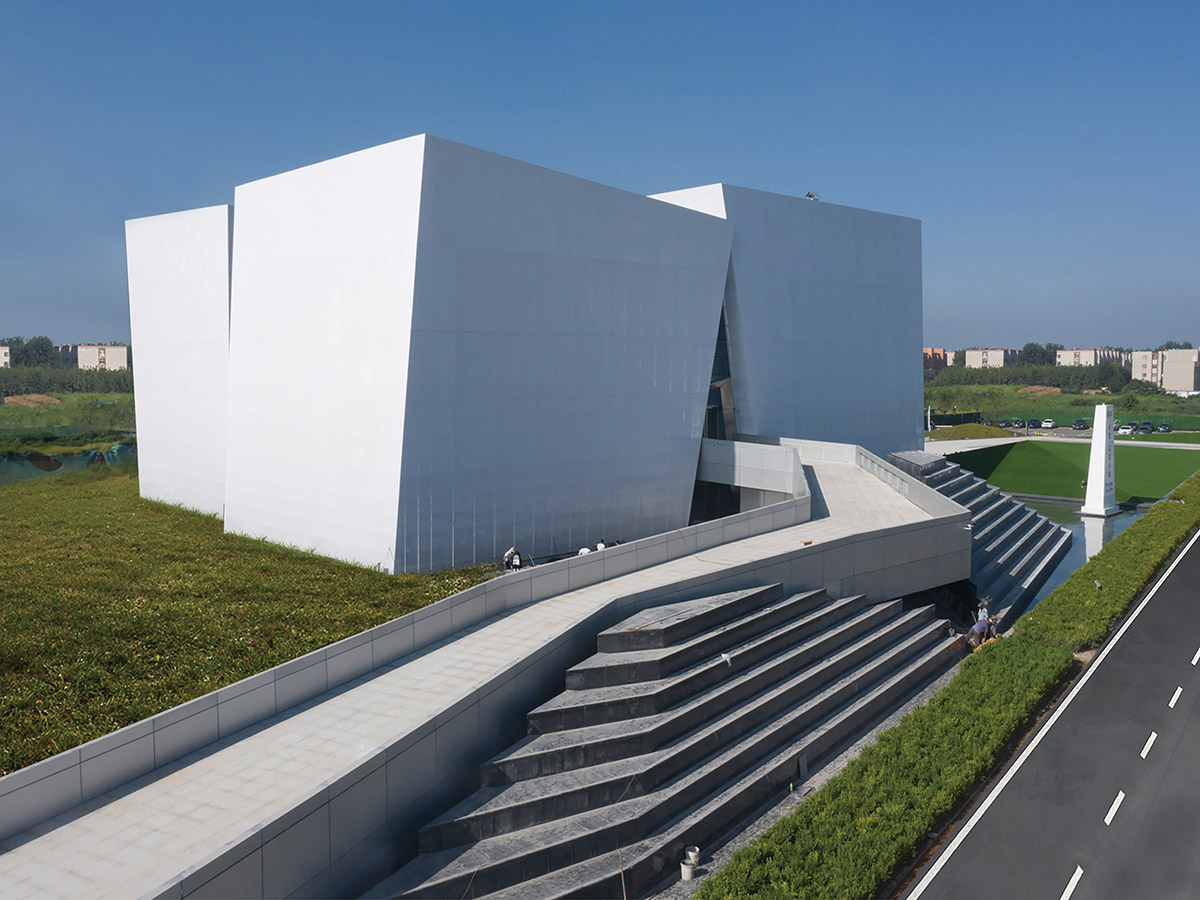 aoe built ShuiFa Info Town Property Exhibition Centre with all-white perforated volumes in China